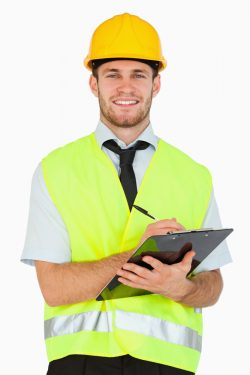 Smiling young foreman with his clipboard against a white background